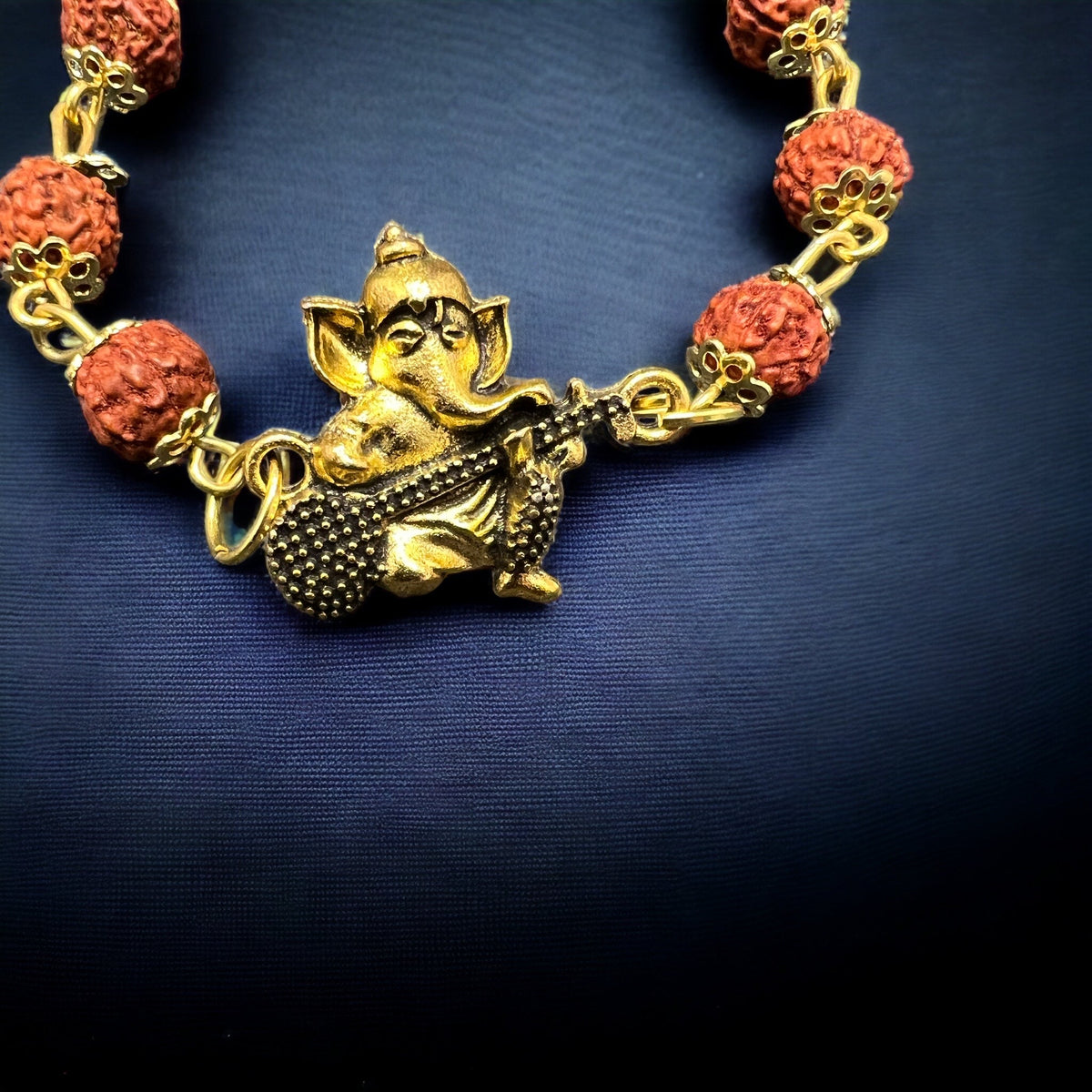 Rudraksha Bracelet Golden Cap Rudraksha Beads With Ganesh Ji Design.